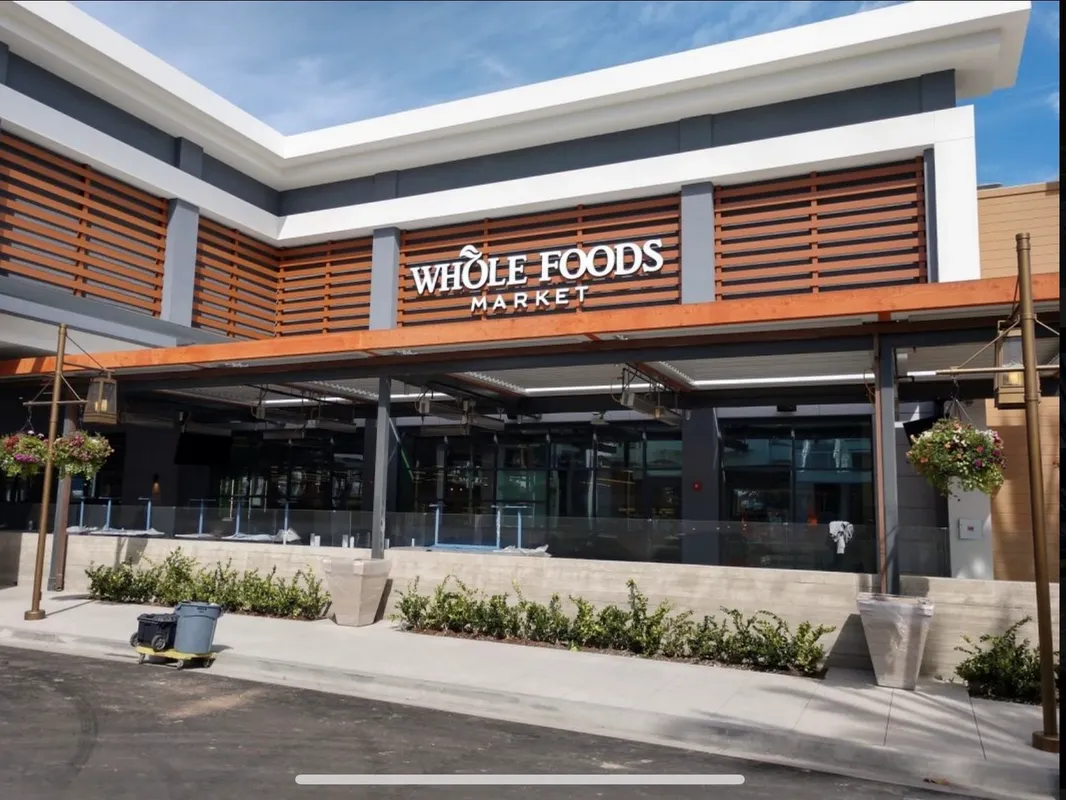 Whole foods outside view with a plant