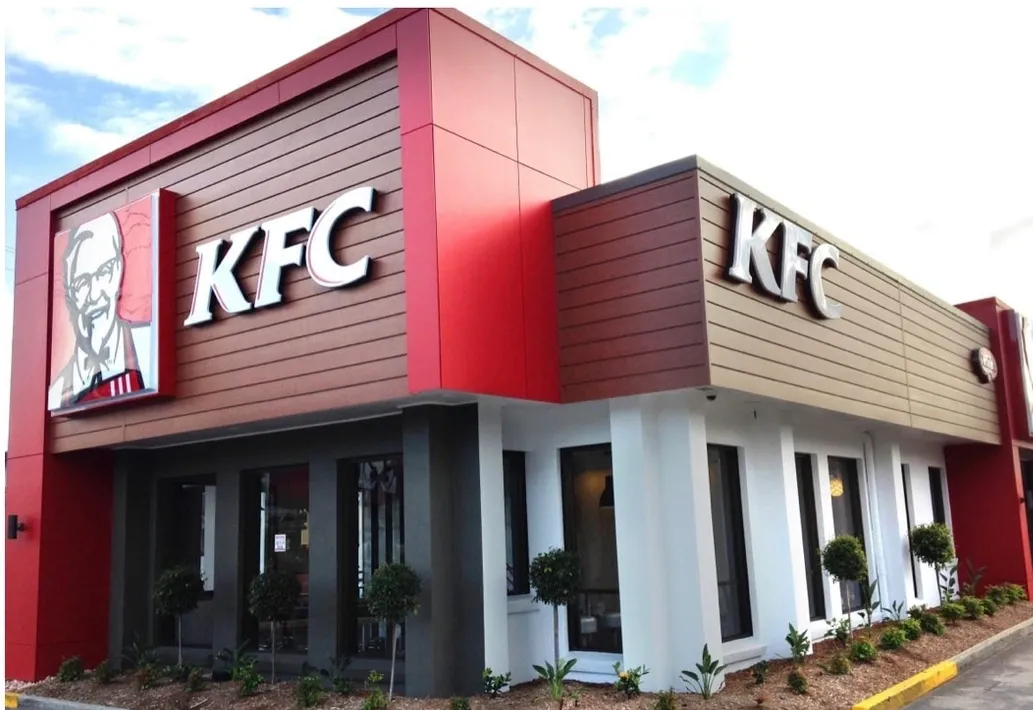 Outside view of a KFC with some plants